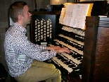 Gavin Raberts at the organ in Hereford Cathedral